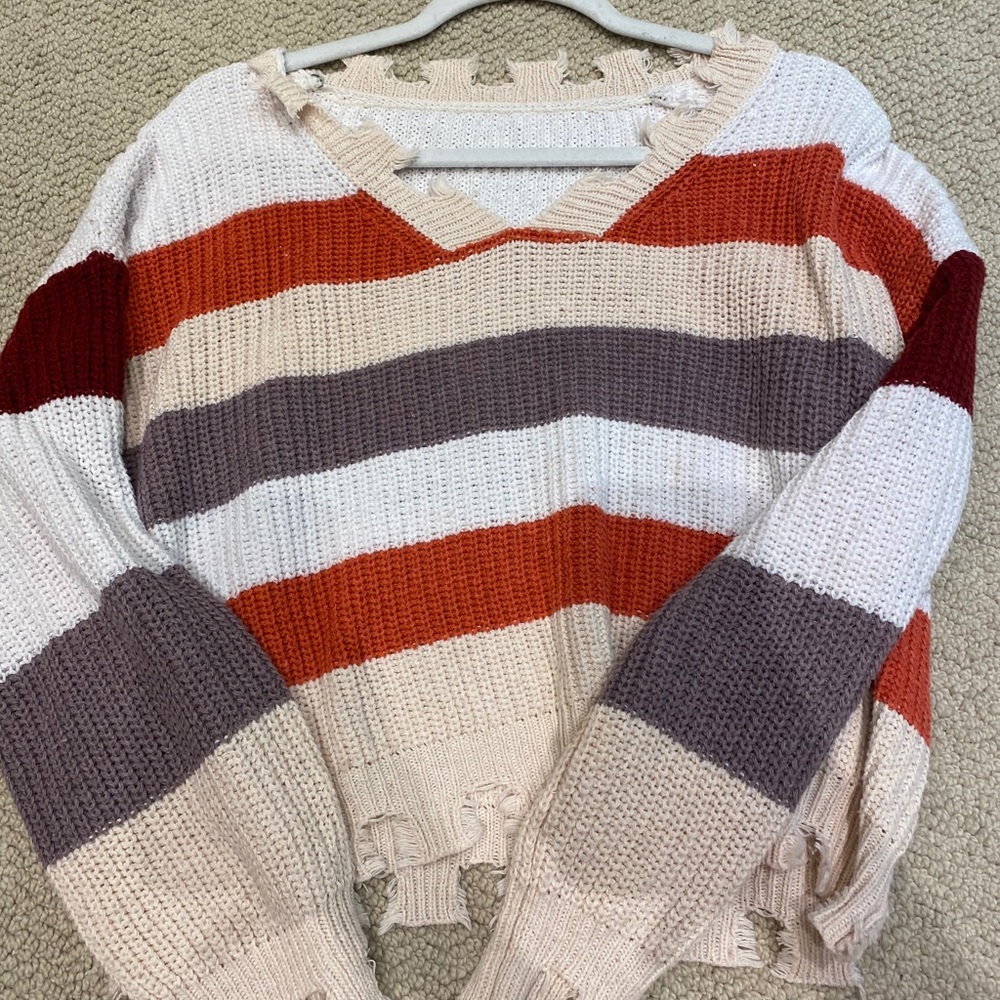 Colorblock distressed v neck sweater